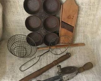 Rustic muffin tin, antique slicer and other kitchen tools