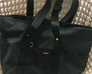 Black Everest large canvas tote bag--has side pocket and bottom zipper compartment