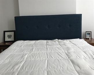 Queen bed with Casper style mattress and fabric headboard.
