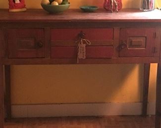 Orange distressed wood sideboard 