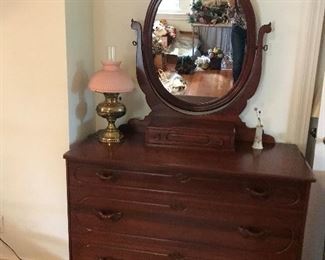 Large antique dresser with large oval mirror, three large drawers