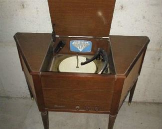 Record player in cabinet by Magnavox