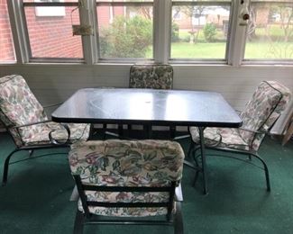 #29 Green Aluminum Glass Top Table w/4 chairs & cushions  60x37x28  $ 75.00