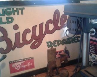 Signs from the store, skill saw, drill press