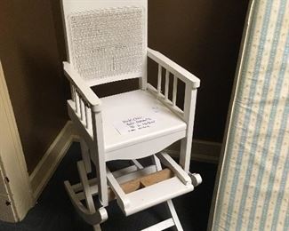 Antique high chair that converts to a rocker.