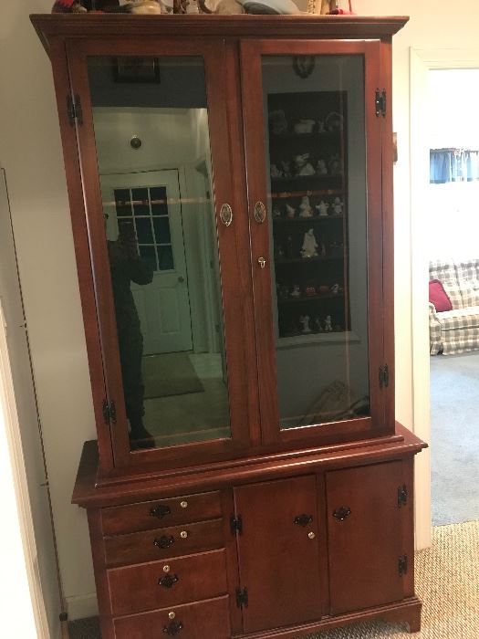 Beautiful mahogany gun safe with multiple locking compartments.