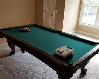 Thomas Aaron Pool Table is near perfect condition. Asking $950 and is negotiable. Comes with Cues, balls, rack etc. Clock sold separately. Pick-up arrangement can be discussed with family if not on sale days