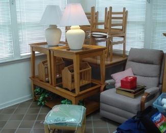 Table and four chairs, pair of pottery table lamps, two glass-top end stands and glass-top coffee table, upholstered recliner. 