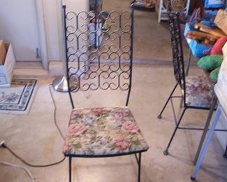 4 matching wrought iron chairs