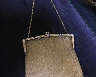 Circa 1920s solid 14k gold mesh purse with diamonds and emeralds