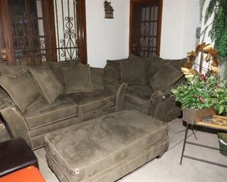plush olive toned couch, loveseat, and ottoman. Talavera tile top tables. Various silk and ornamental plants