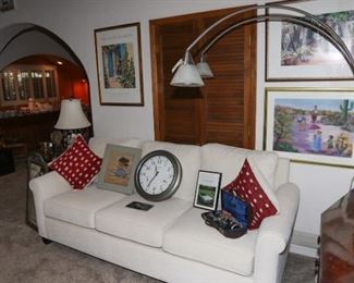 large off-white couch, overhanging lamp with marble base