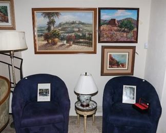 plush blue swivel chairs, vintage European end table and Asian lamp