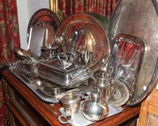 Various silver plate decorative servings pieces. Large gold leaf framed antique mirror. Buffet