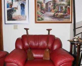 Marble top side table/ stand. Red leather chair. Steel canoe paddles