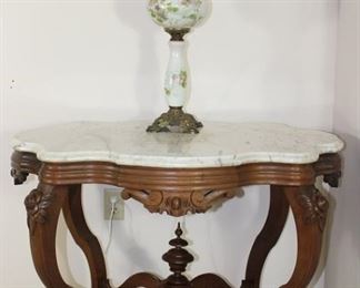 Victorian White Marble Top Center Table, 38 1/2” W x 25 1/2 D x 28” H.  Also shown with Hand Painted victorian Oil Lamp, 29” H