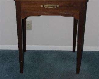 Closed View: Singer zigzag sewing machine model 360 in wood cabinet c. 1975