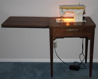 Singer zigzag sewing machine model 360 in wood cabinet c. 1975