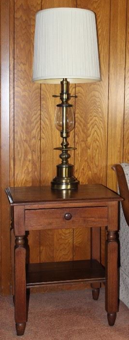 Vintage end table with single drawer and lower shelf (22”W x 18”D x 26”H), shown with tall brass table lamp (1 of 2 shown)