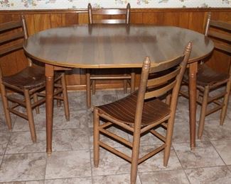 Vintage maple Formica topped round table with Leaf 42” x 52” shown with ladder back slat bottom chairs 4 each