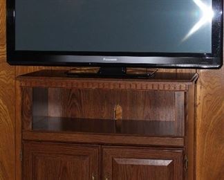 Panasonic 2011 42” Smart TV shown with TV/Microwave Stand 