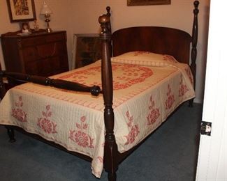 Vintage Cannon Ball Poster Double/Full Bed shown with a Handmade Red Embroidery Cross stitch Quilted Bedspread.