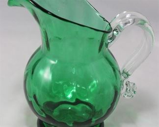 Blown glass green pitcher with clear applied handle (7 1/2” H)