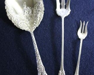 “Chrysanthemum” by Durgin Sterling Silver Vegetable Serving Spoon c.1896; Towle Sterling “Old Colonial” Lettuce Serving Fork c.1895; Daniel Low & Company Sterling Silver Cocktail Fork 1867-1911