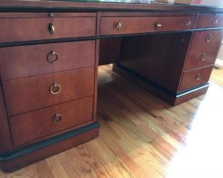 Beautiful National Mount Airy Executive desk in rich Walnut and black accents with protective glass top