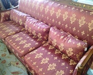 Three-cushioned sofas with extra pillows