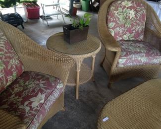 Matching chairs, round side table, and oval coffee table