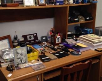 Desk, shelving, and many office supplies