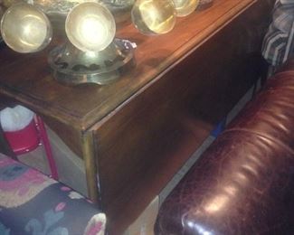 Drop leaf table that looks like a desk from the left side