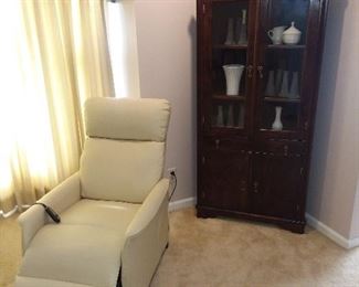 Ladies white vinyl Lift Recliner. Small corner cupboard.