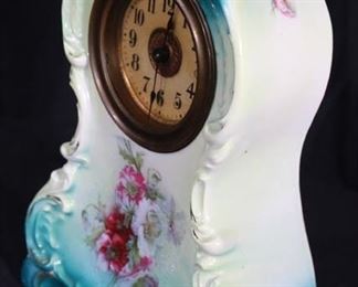 310a  Porcelain clock with wind up works, 11 in. T.