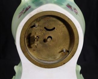 310c  Porcelain clock with wind up works, 11 in. T.