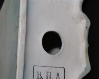 310d  Porcelain clock with wind up works, 11 in. T.