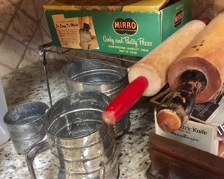 Vintage rolling pins and flour sifters