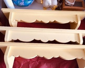 Three yellow shelves