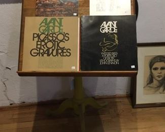 Avant Garde magazines and cast iron library stand