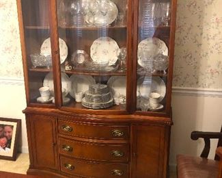 China cabinet containing large fried eggs
