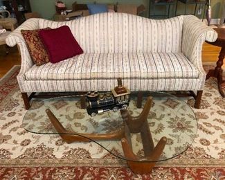 Is that a glass BOOMERANG COFFEE TABLE!!!!!!!! You will have to fight me for that. That's a carved teak base!!!