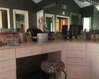 Magestic master bathroom you gotta get that flouncy stool there, right?