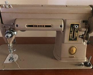Singer sewing machine! Learn a craft, be useful in the upcoming post-internet society!