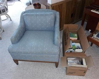 Upholstered Arm Chair and Books