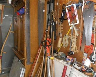 Several old Saws and Yard Tools
