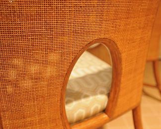 5 Barbara Barry for McGuire caned arm chairs in pecan finish; custom upholstery; McGuire bamboo and rawhide 5-leg table with beveled glass top