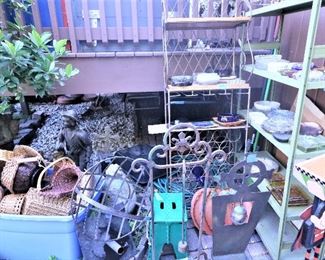 Wicker baskets, garden sculptures, outdoor Halloween decor, and numerous vintage ashtrays