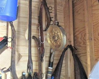 Antique fork, antique horse tacks, and antique workhorse equipment.
