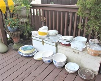Vintage Pyrex, vintage CorningWare, serving platters, stoneware bowls, collectible plates, mixing bowls, and other kitchenware.